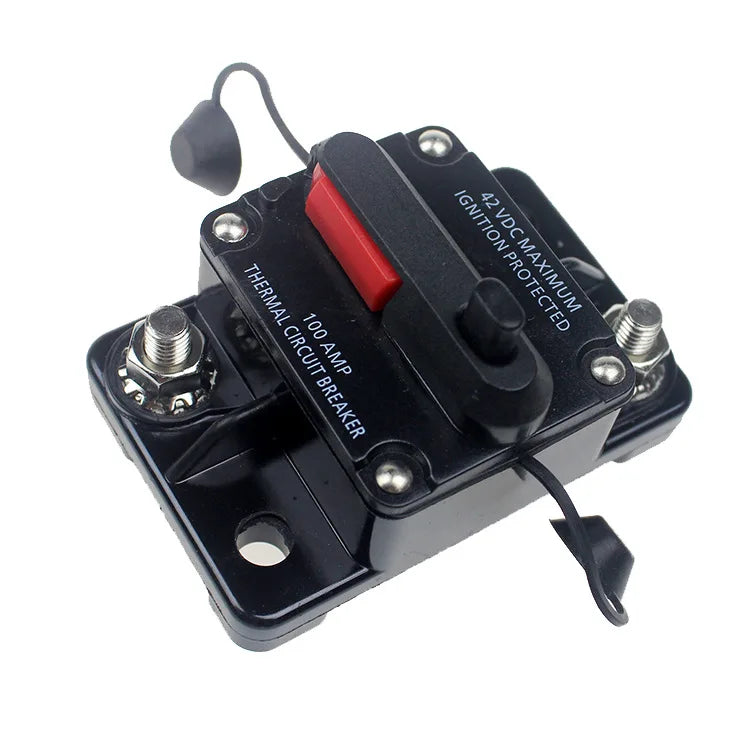 Disjoncteur-fusible réarmable noir avec levier rouge et capuchon de protection