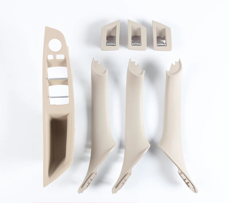 Kit de poignées intérieures BMW F10 F11 F18 en finition ivoire présenté en 7 pièces